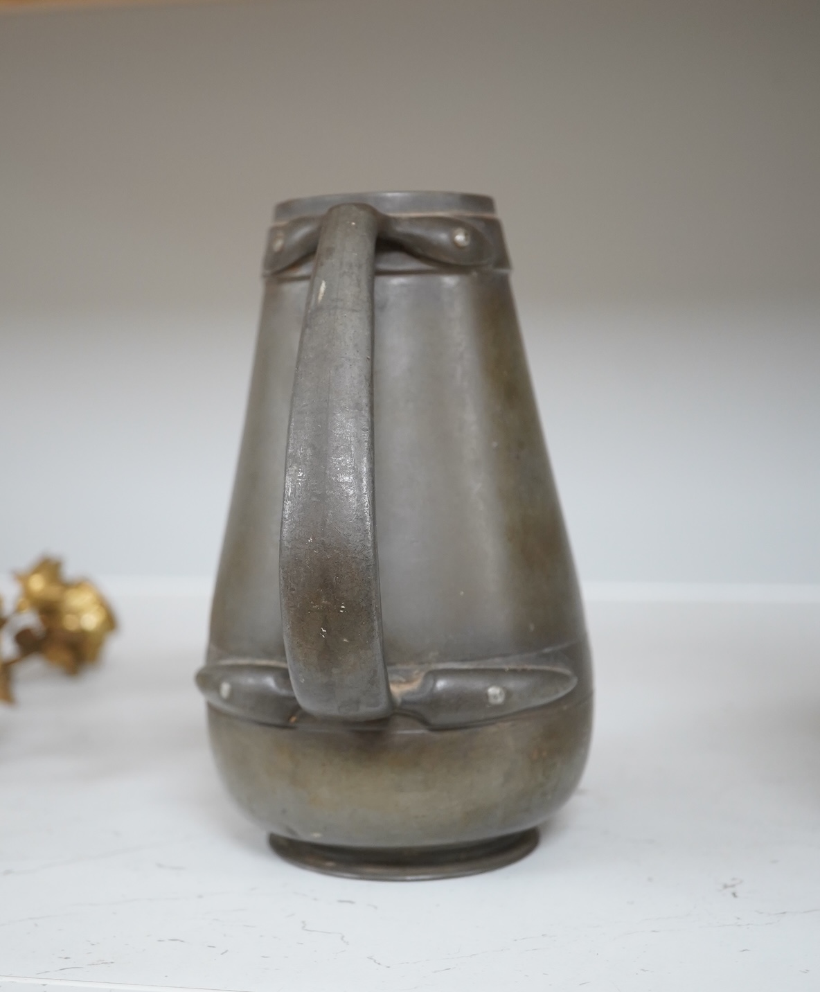 A Liberty Tudric pewter water jug, 17cm high. Condition - fair